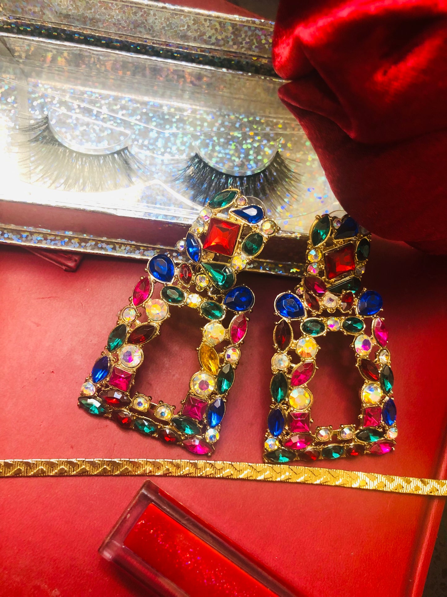 A pair of lashes and holiday earrings make the best stocking stuffers